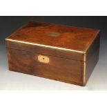 AN EARLY VICTORIAN OAK AND BRASS BOUND WRITING SLOPE with fitted interior and hinged rising lid,