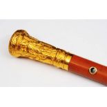 AN 18TH CENTURY GOLD TOPPED MALACCA WALKING CANE, repoussé decorated with classical figures, marks