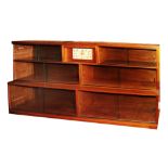 A 20TH CENTURY MINTY SECTIONAL BOOKCASE with various glazed shelves around a central clock