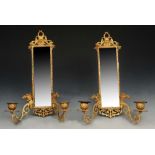 A PAIR OF GILT METAL GIRANDOLE MIRRORS with mythical beasts, 33cm high