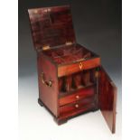 A VICTORIAN MAHOGANY APOTHECARY'S CABINET with six bottle compartments enclosed by hinged rising