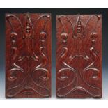 A PAIR OF ART NOUVEAU CARVED OAK PANELS with stylised scrolling foliate motif, 30 x 16cm (2)