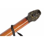 AN OLD MALACCA WALKING CANE, the bronze patinated finial cast head and shoulders profile of