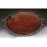 AN ANTIQUE OVAL CARVED WOODEN TRAY with snake handles and frog ornament, 64cm wide