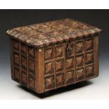 AN INDIAN HARDWOOD CASKET, with pyramid shaped metal mounts, 21cm x 27cm.