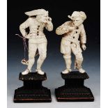 CIRCLE OF WILHELM KRUGER (1680-1756) A pair of German ivory figures, of a merchant and a Jester,