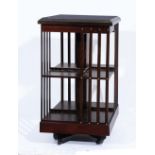A MAHOGANY AND SATINWOOD INLAID SQUARE REVOLVING BOOKCASE, three tiers with slatted sides, 46cm