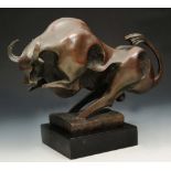 A CONTEMPORARY BRONZE SCULPTURE of a ranging bull on naturalistic square base, indistinctly signed