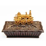 RAILWAYANA: a 19th Century bronze and gilt metal desk ornament of sarcophagus form, the upper part