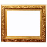 A 19TH CENTURY PRE-RAPHAELITE GILT AND GESSO FRAME, the deep border moulded with branches of ivy