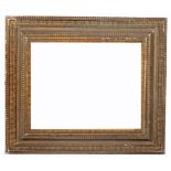 AN ANTIQUE FRAME, the deep border of ripple moulded form, rebate size 54.5 x 42cm