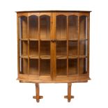 Hugh Birkett (1919-2002) Display cabinet, 1983 yew and elm, wall mounted with arched glazed front,