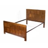 Robert Thompson of Kilburn (1876-1955) Mouseman double bed frame oak, with paneled head and