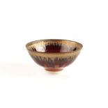 Peter Wills (Contemporary) Footed bowl deep red glaze and dripped manganese rim impressed potter's