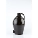 Leach Pottery Cider flagon dark glaze, looped handle impressed pottery seal 34cm high.