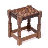 Robert Thompson of Kilburn (1876-1955) Mouseman stool oak, with woven tan leather top carved mouse