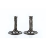 Archibald Knox (1864-1933) for Liberty & Co. Pair of candlesticks, model no.022 pewter, with