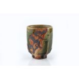 Ken Matsuzaki (b.1950) Tea bowl raku, dripped green glaze and painted motifs, cut sides original
