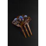 20th Century Simulated tortoiseshell hair comb pierced and carved scroll decoration applied with