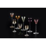 Art Nouveau Eight drinking glasses with enamelled and coloured glass examples tallest 16.7cm high (