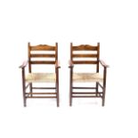 Gordon Russell (1892-1980) Pair of armchairs, circa 1920s yew wood, ladder backs, turned supports