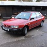 A red 1993 Nissan Sunny 1597cc LX automatic five door hatchback, registration K715 FVX, M.O.T.