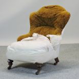 A Victorian brown upholstered nursing chair