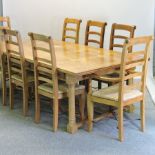 A hardwood refectory table, 230 x 120cm, together with eight chairs,