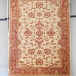 A Ziegler style carpet, with all over foliate design, on a cream ground,