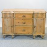 An antique pine sideboard, on turned feet,