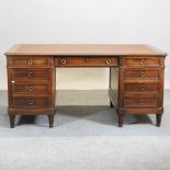 A 19th century mahogany pedestal desk, with a leather inset top,
