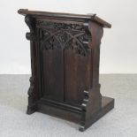 A Victorian carved oak lectern,