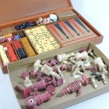 A 19th century bone part chess set, together with a 20th century games compendium, cased,
