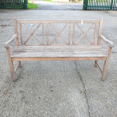 A wooden slatted garden bench,