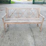 A wooden slatted garden bench,