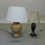 A table lamp, together with another,