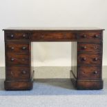 A Victorian mahogany pedestal desk, with an inset leather top,