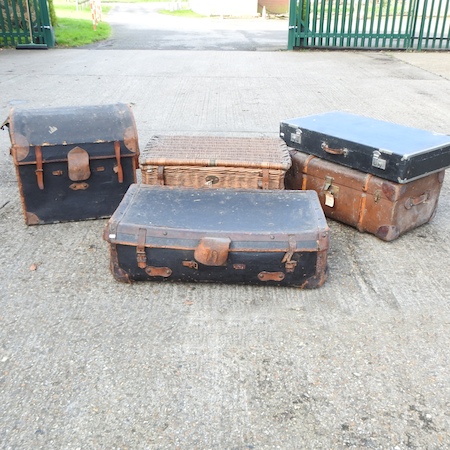 An early 20th century black dome top trunk, 63cm, together with a wicker basket,