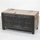 An 18th century carved oak coffer,