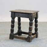 An 18th century oak joint stool.