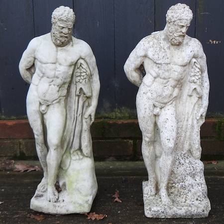 A pair of reconstituted stone garden figures of Hercules,