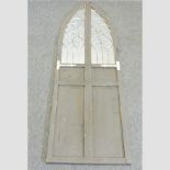 A Gothic style grey painted wall mirror,