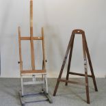 A wooden artist's easel, together with another smaller,