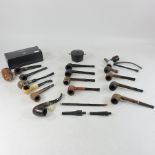 A collection of pipes, together with an ebonised trinket box,