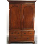 A Victorian mahogany double wardrobe, with drawers below,