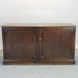 A 19th century mahogany side cabinet, on a plinth base,