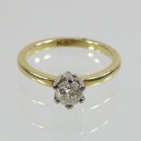 An 18 carat gold solitaire diamond ring, approximately 0.