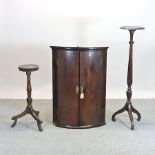 A George III mahogany bow front hanging corner cabinet, 71cm,