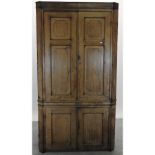 A George III oak standing corner cabinet,