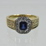 An 18 carat gold sapphire and diamond cluster ring,